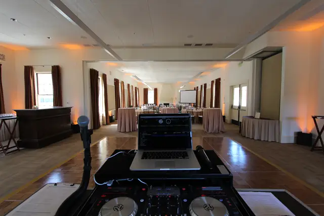 DJ controller and laptop set up on the dance floor facing the ballroom at Cavallo Point