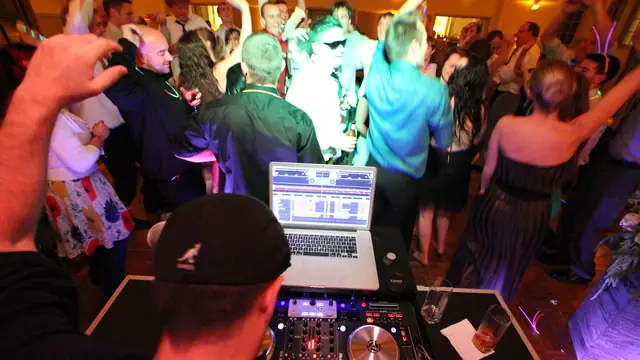 A packed dance floor seen from behind the DJ booth at Cavallo Point in Sausalito
