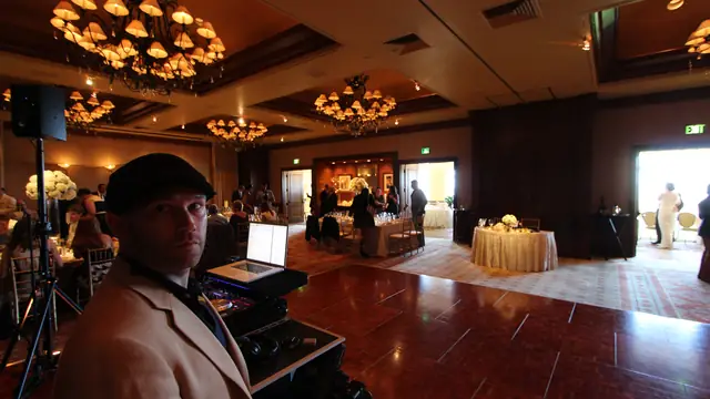 Wayne Noel at his DJ setup during a wedding reception at the Inn at Spanish Bay
