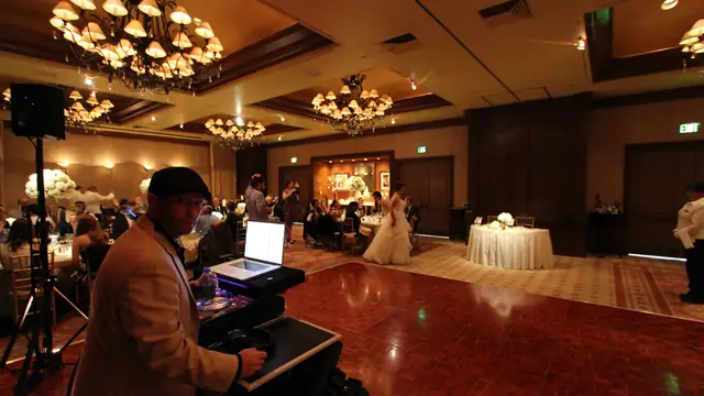 Wayne Noel working his DJ rig at a wedding in the ballroom at the Inn at Spanish Bay