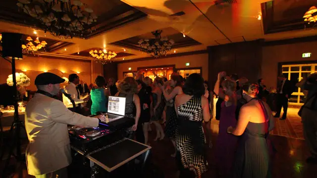 Wayne Noel playing a dance set as guests fill the floor at the Inn at Spanish Bay ballroom