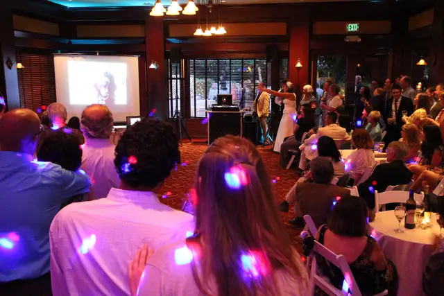 DJ Wayne Noel beside his booth during the toasts and slideshow at an Inn Marin wedding reception