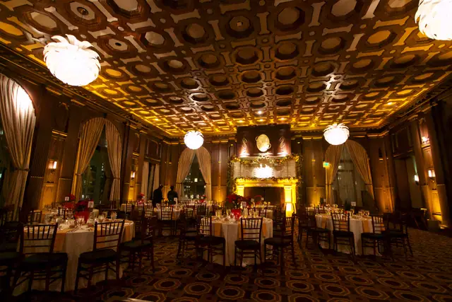 Fireplace with garland and arched windows at the end of the Julia Morgan Ballroom in San Francisco