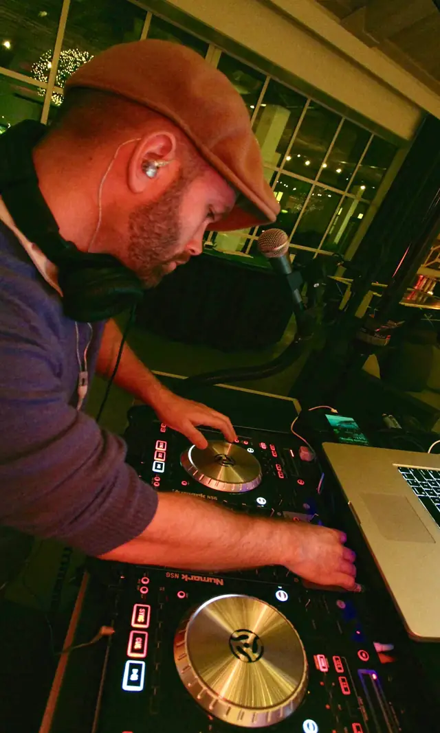 DJ Wayne Noel mixing on his controller at an event at Solage in Calistoga