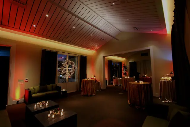 Candlelit lounge area with red uplighting in a reception room at Solage, Calistoga