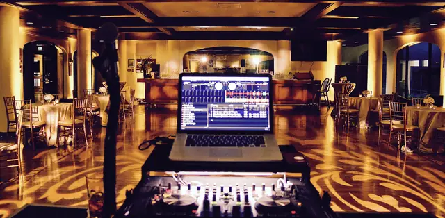 Wayne Noel's DJ laptop and controller facing the bar and dance floor at St. Francis Yacht Club in San Francisco