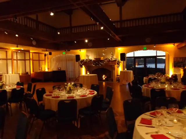 Wayne Noel's DJ table and speakers beside the fireplace in the beamed main hall at St. Francis Yacht Club