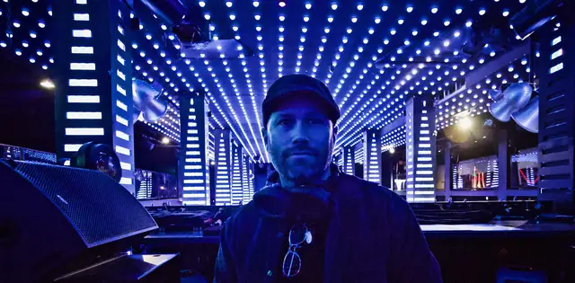 Wide view across the room at Temple nightclub in San Francisco from the DJ booth, with LED ceiling and columns and Wayne Noel in the center