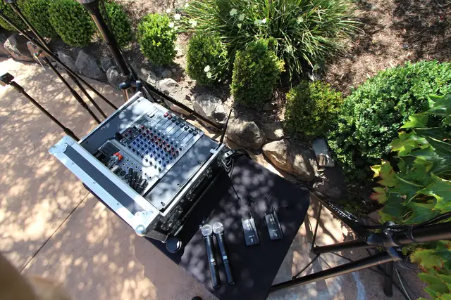 Top-down view of a wireless mic setup on a table in the gardens at Viansa Winery