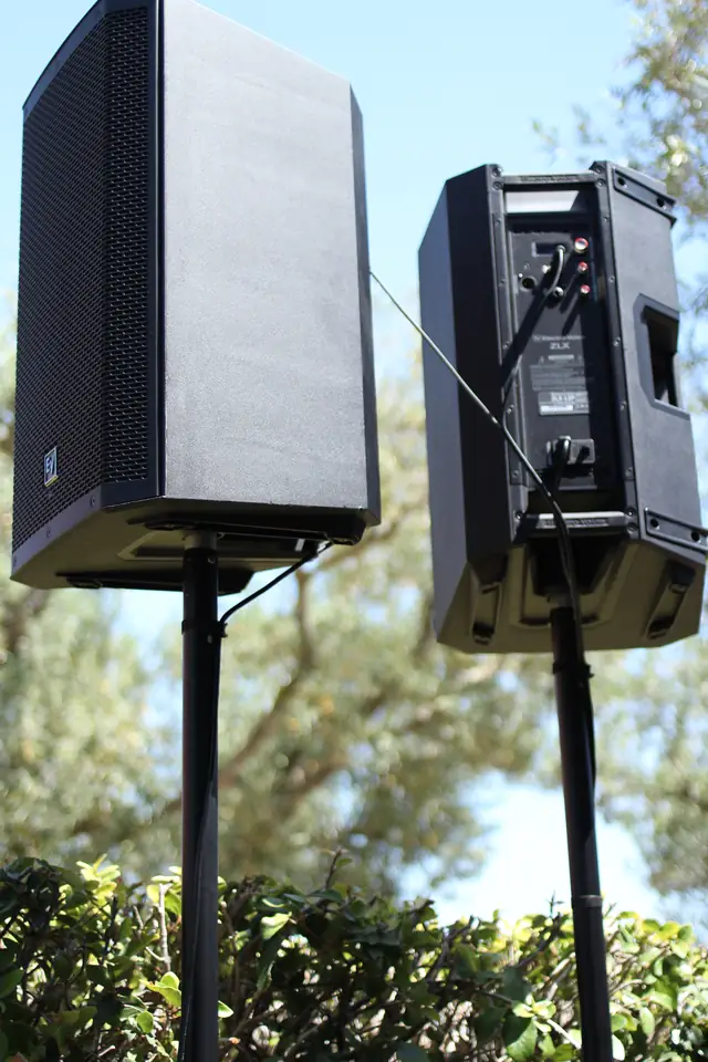 Close view of two powered speakers on stands outdoors at Viansa Winery